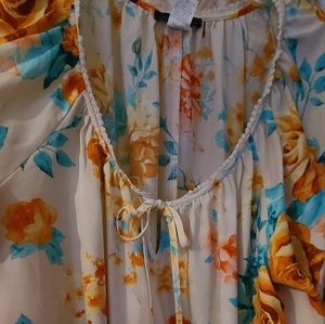 Beautiful, floral women's plus 3X size blouse with key hole neckline to tie